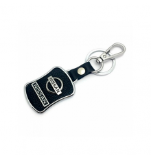 Брелок металл,кожа Ниссан 3,8*7 см  черный  логотип c надписью на подвеске