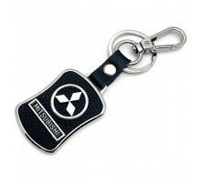 Брелок металл,кожа Митсубиси 3,8*7 см черный  логотип c надписью на подвеске